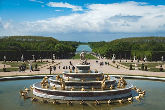 pexels-photo-4845973-4845973 Stunning view of the opulent water fountain in the Gardens of Versailles under a clear blue sky.